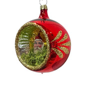 Three decorative Christmas indent ornaments with a central ephemera antique Santa figure, each on a different colored blown glass ornament.  RED VERSION 