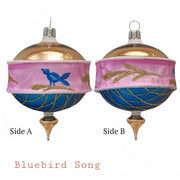 Bluebird Song 3.25 in Drop ornament, gold dome top with pink and blue band, gold glitter details, wooden finial base