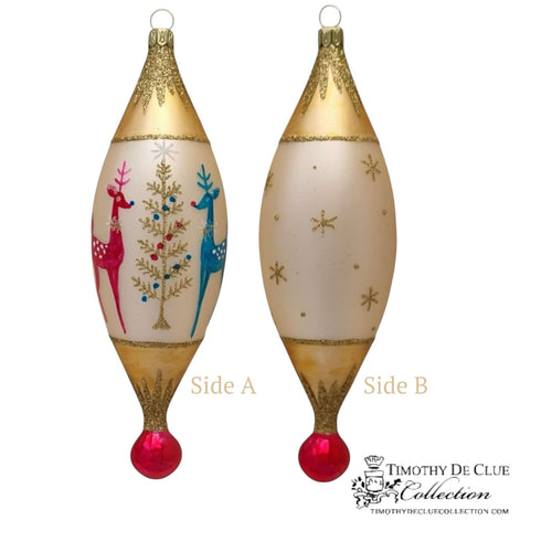 Deko-Hirsch 7.5 in Tear Drop ornament with gold glitter top, cream body featuring red and blue reindeer, snowflakes, red ball base