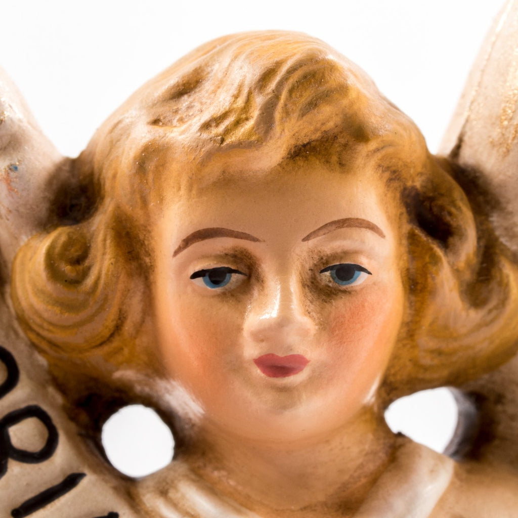 Angel figurine holding a 'Gloria in Excelsis Deo' banner, The Vintage Inspired Gloria Angel, measuring between 4.5 and 5.75 inches, embodies the sacred proclamation of "Glory to God in the highest," Marolin Made in Germany