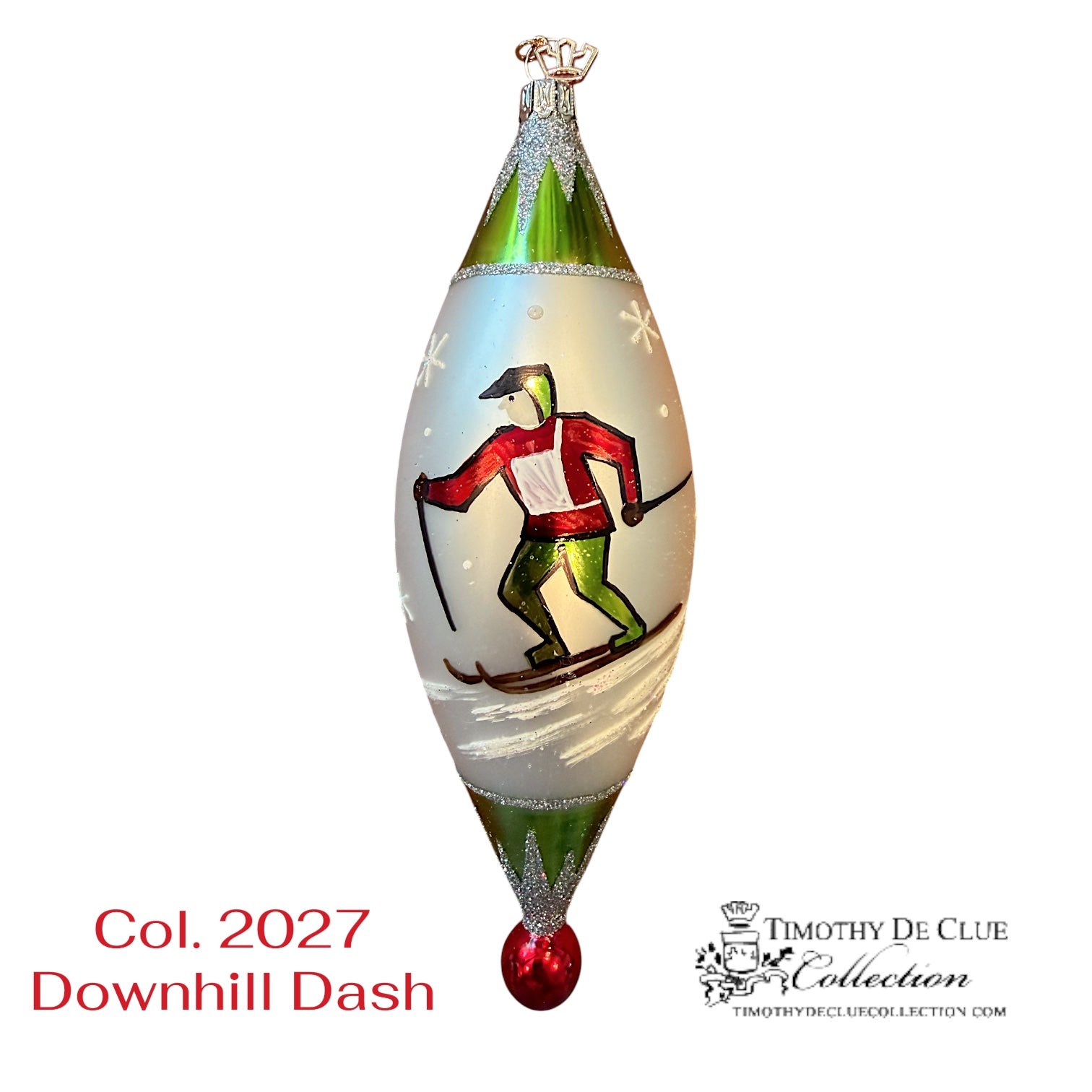 Downhill Dash ornament featuring skier in red jacket on frosted teardrop, green top, red base