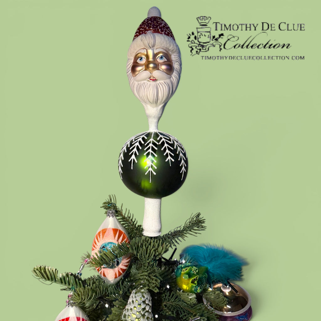 Kringle Finial Tree Top with bearded Santa head, dark green ornament, and decorated evergreen base with colorful baubles