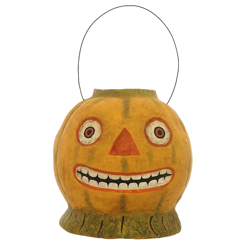 Pumpkin-shaped lantern with a face on a white background