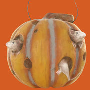 Decorative pumpkin paper mache with small mice figures on a white background