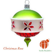 Christmas Rose 3.25 in Drop ornament, lime green top with cream band featuring red flower designs and red ridged bottom section