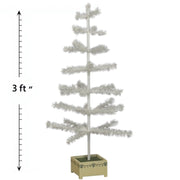 A 3-foot tall white feather Christmas tree with a hand-painted wooden base