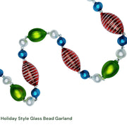Glass bead garland with red and green beads on a white background, made Czechia Europe.