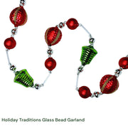 Glass bead garland with red and green beads on a white background, made Czechia Europe.