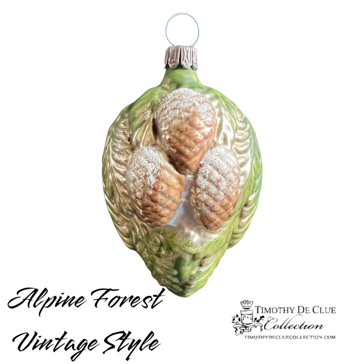 Alpine Forest Vintage Style German glass ornament with pinecones, green leaf details, and silver accents