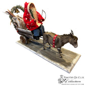 Donkey Cart Santa Candy Container, full view on wooden base with gray donkey, red coat figure, and decorated sleigh.