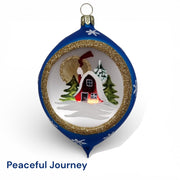Decorative Christmas ornament with a house and trees design, featuring snowy country scene designed by Timothy De Clue
