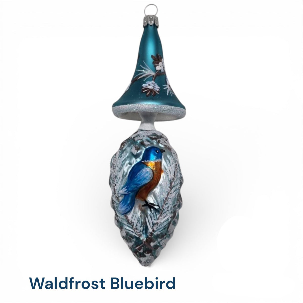 Mushroom top ornament with icy branches and oine cones, featuring bluebird on pine cone, vintage mold designed by Timothy De Clue