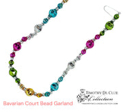 Bavarian Court Bead Garland displayed flat with multicolored faceted beads in pink, teal, green, gold, and silver.
