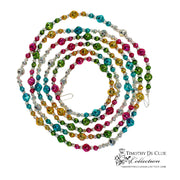 Bavarian Court Bead Garland with multicolored faceted beads in pink, teal, gold, green, and silver arranged in concentric loops.