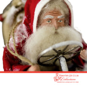 Driving Shoe Crazy Santa closeup showing white fur beard, red hat with white trim, and holding staff with gold bow detail