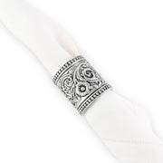 Concho Pattern Napkin Rings Set of 4, worn on white napkin showing engraved detail