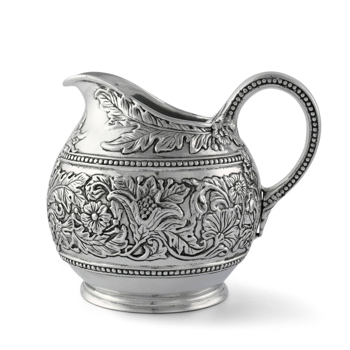 Concho Pattern Pitcher, silver metal with ornate floral embossed design and beaded trim