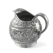 Concho Pattern Pitcher, silver metal showing interior with pouring spout open