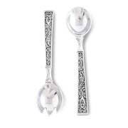Concho Pattern Serving Set with two silver spoons featuring ornate handles.
