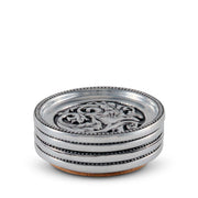 Concho Western Drink Coaster Set of 4, single coaster shown with silver metal rim, embossed scrollwork center, and cork base.