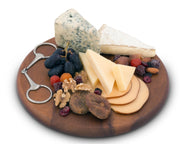 Cheese Board - Equestrian Bit with assorted cheeses, grapes, nuts, dried berries, and metal bit-shaped server on wooden round platter.