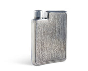 Black Forest Pewter Flask, angled view showing textured wood-grain surface and hinged cap
