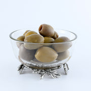 Acorn & Oak Leaf Dip Bowl filled with green olives, silver leaf-shaped base supports glass dish.
