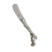 Acorn Spreader with silver handle and stainless steel blade featuring decorative leaf motif.