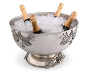 Charter Oak Ice Tub Punch Bowl in silver metal with leaf design, filled with ice and champagne bottles