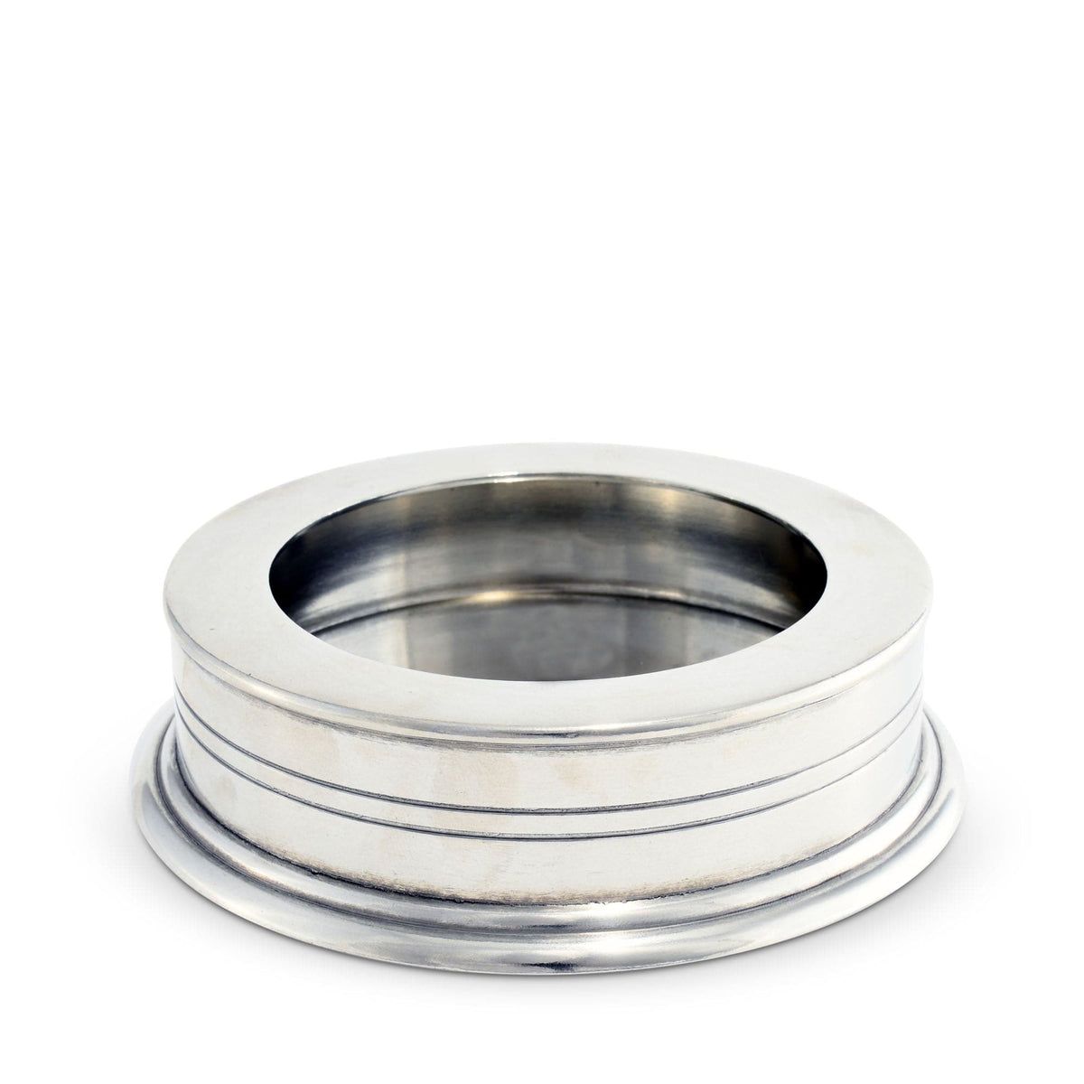 Classic Pewter Wine Coaster, round metallic dish with grooved sides and hollow center, angled view.