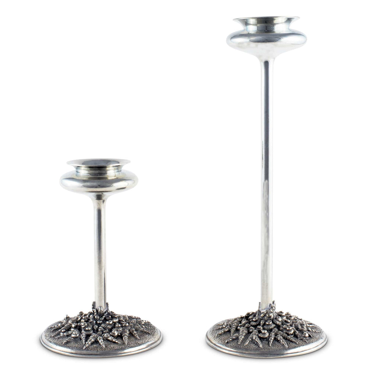 Coastal Tide Candlestick in silver metal, shown in two heights with textured sea-inspired bases.