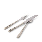 Concho Flatware three-piece set with decorative silver handles and metal utensils.