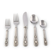 Concho Flatware five-piece place setting with decorative silver handles displayed.