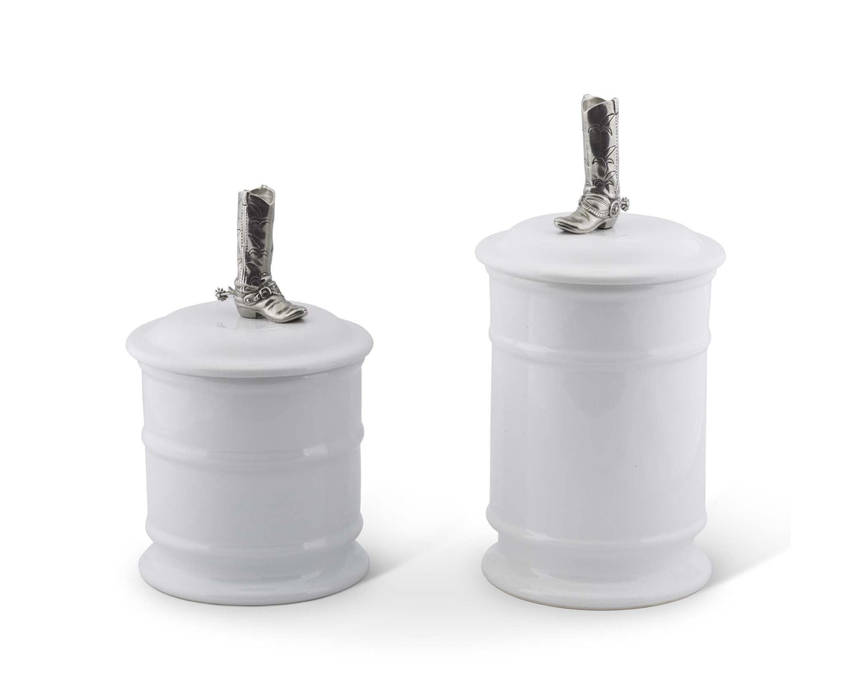 Cowboy Boot Stoneware Canister in white with silver boot-shaped lid finial, shown in two sizes